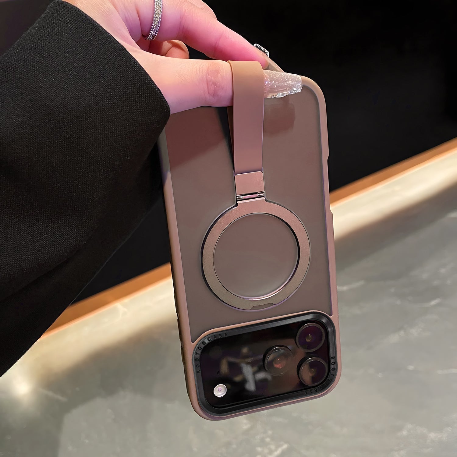 hand holding grip band case for iphone 17 Pro and Pro Max